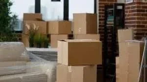Variety of packing materials including boxes, bubble wrap, and packing paper for secure moving